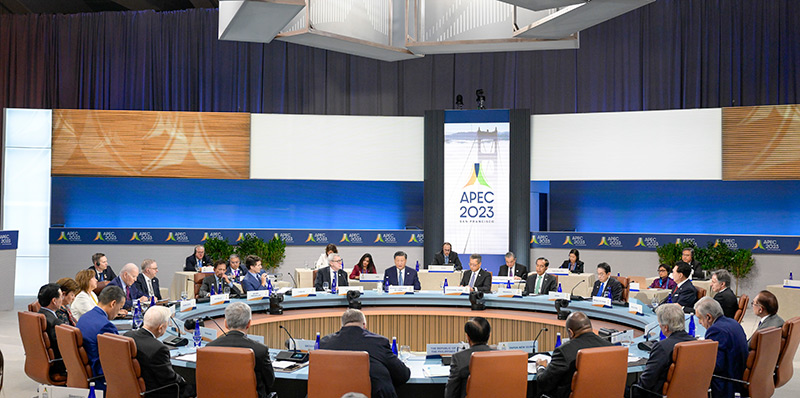 Delegates seated around the conference table at APEC 2023.