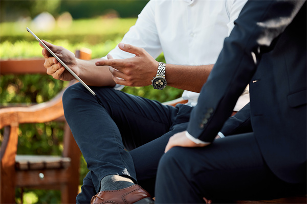 Business professionals meeting outdoors.